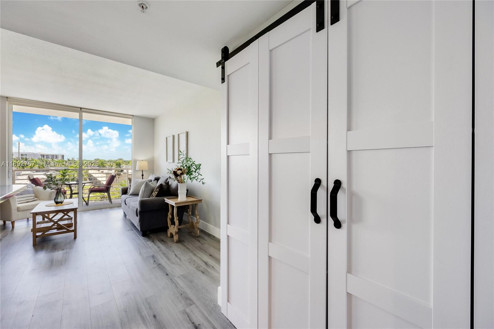 2775 Northeast 187th Street, Unit 309 Aventura, FL 33180 - Photo 11 of 21 a living room with furniture