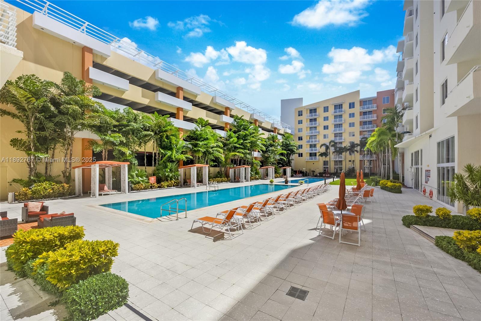 2775 Northeast 187th Street, Unit 309 Aventura, FL 33180 - Photo 16 of 21 a view of a fountain with a bench in patio