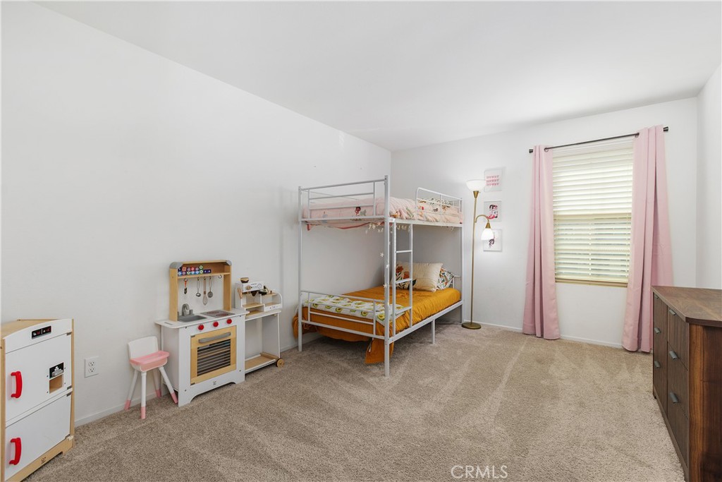 3056 Eveningcloud Street Hemet, CA 92543 - Photo 22 of 48 a bedroom with furniture and white walls