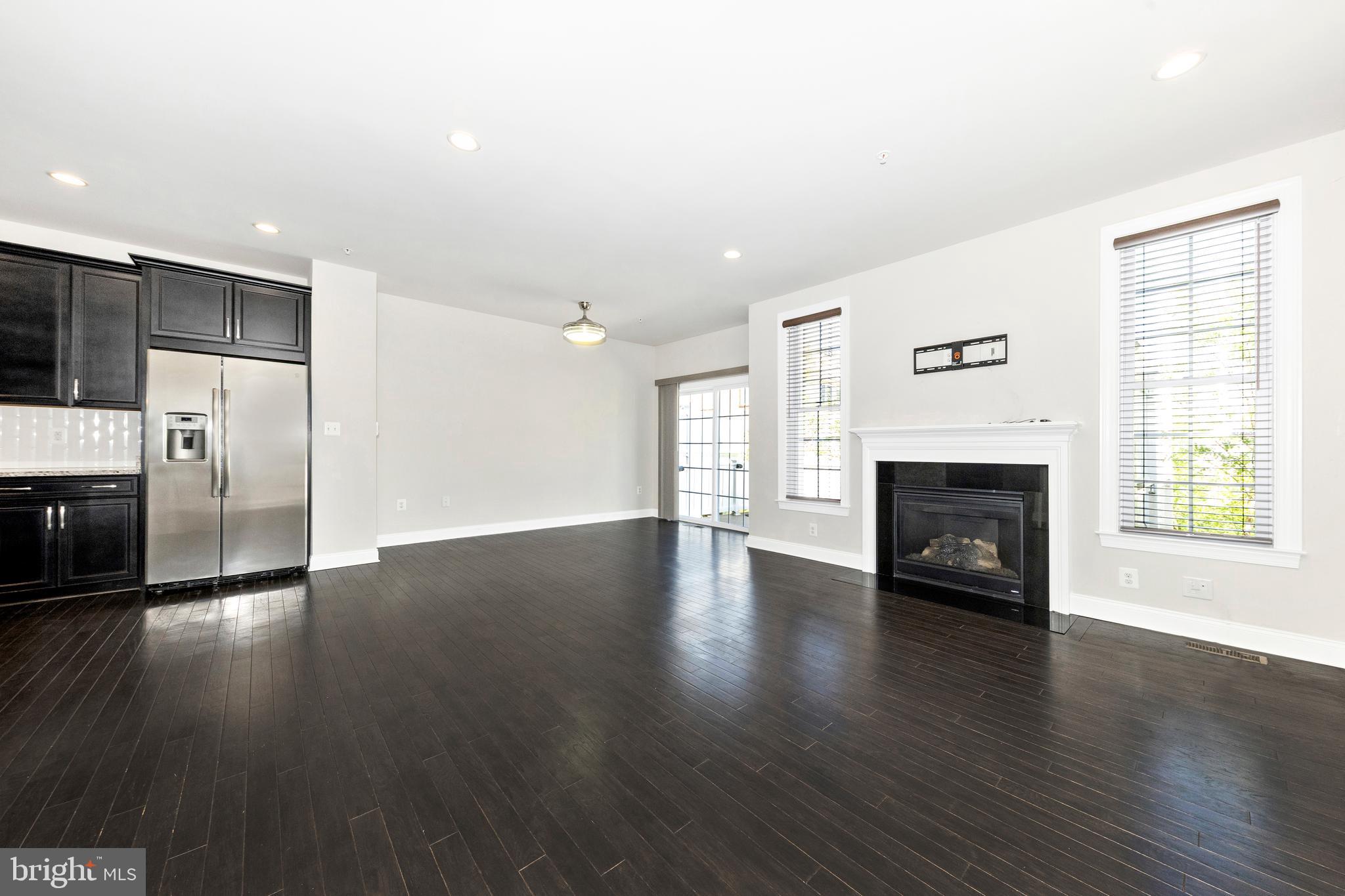 2325 Asberry Road Hanover, MD 21076 - Photo 17 of 65 a view of empty room with wooden floor and fireplace