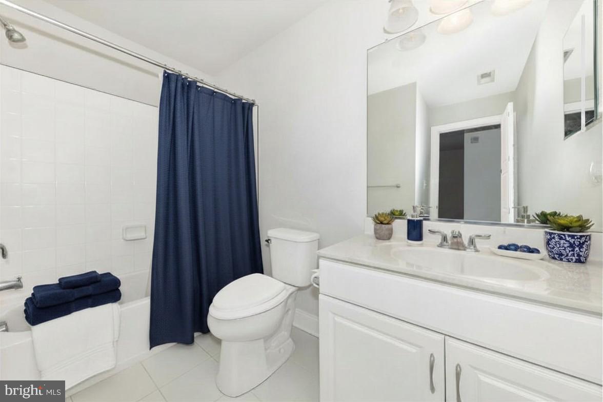 2325 Asberry Road Hanover, MD 21076 - Photo 33 of 65 a bathroom with a sink a toilet a shower and a mirror