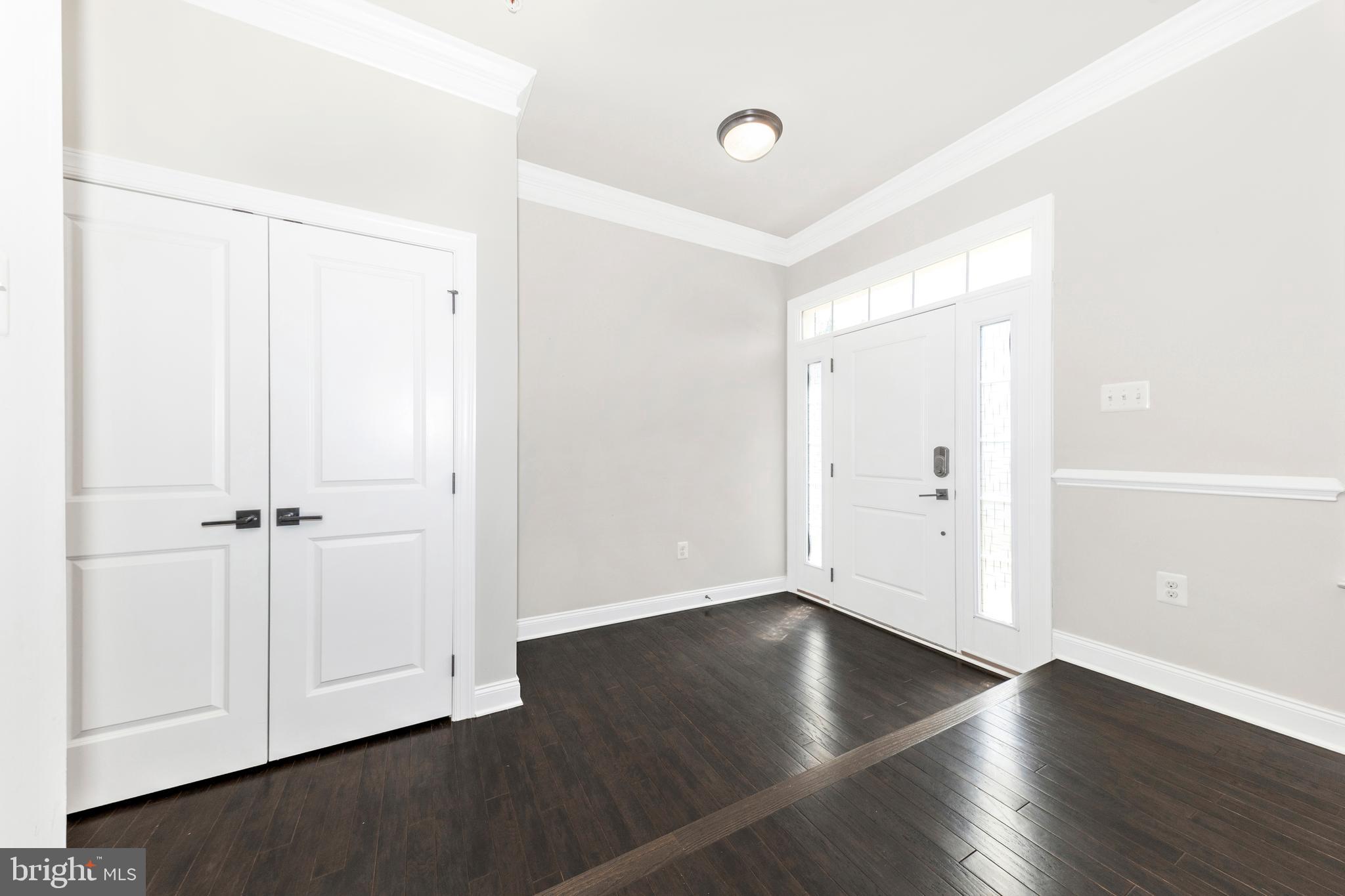 2325 Asberry Road Hanover, MD 21076 - Photo 6 of 65 an empty room with wooden floor