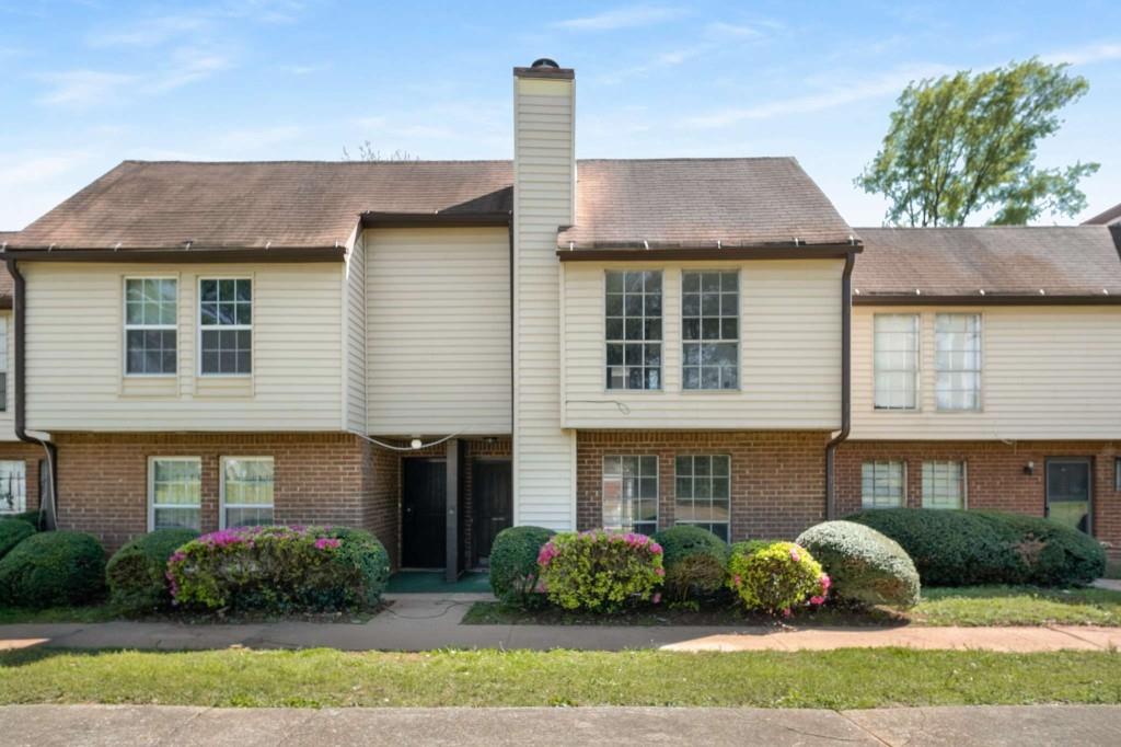3254 Strawberry Lane Decatur, GA 30034 - Photo 2 of 27 a front view of a house with a garden and plants