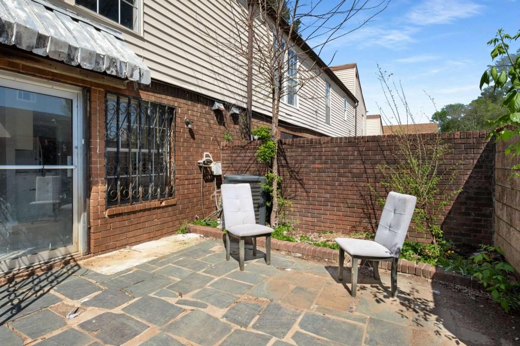 3254 Strawberry Lane Decatur, GA 30034 - Photo 23 of 27 a view of a chairs and a tables in the patio