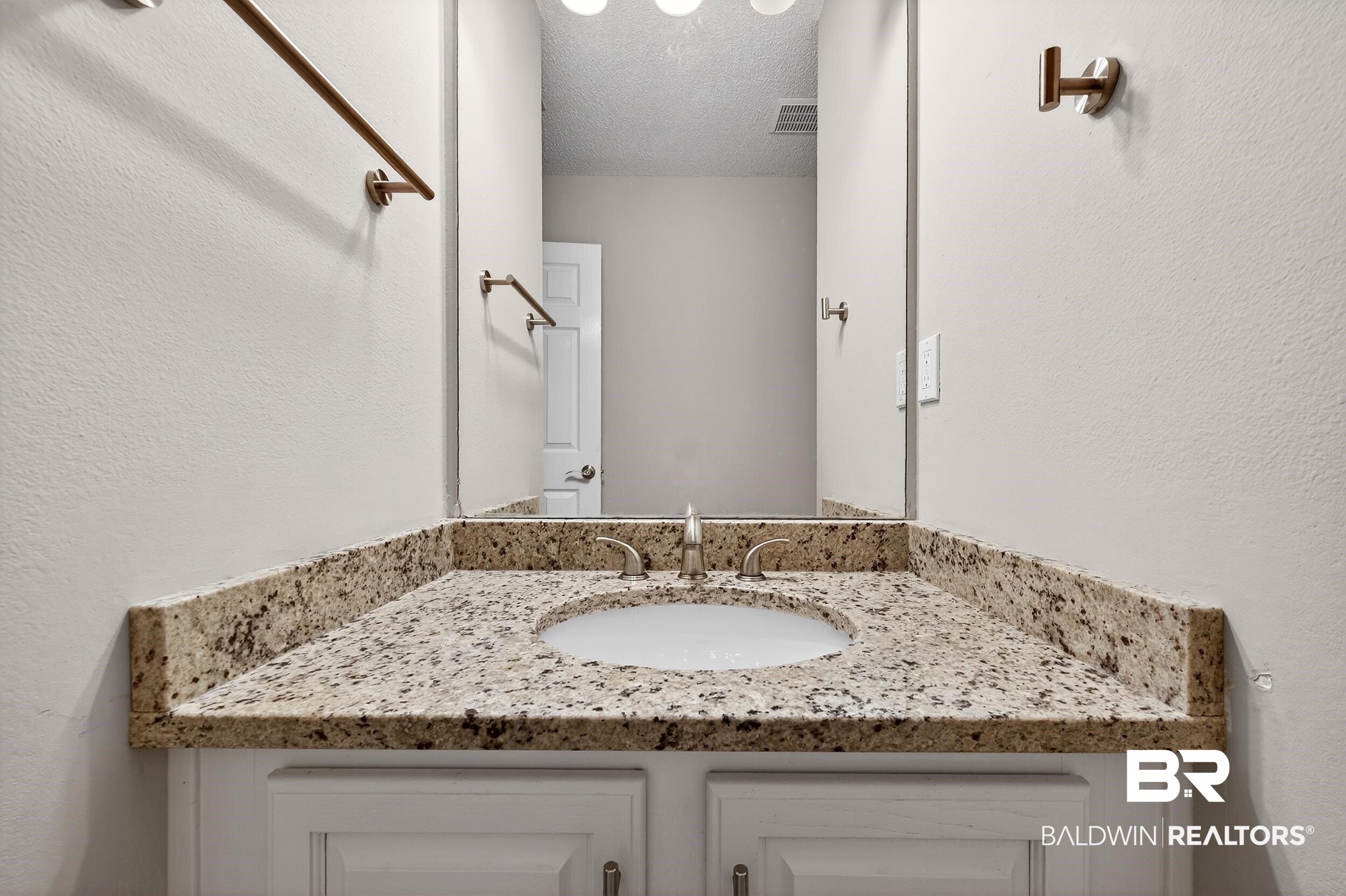 7050 Highpointe Place West Daphne, AL 36527 - Photo 32 of 66 Bathroom featuring a textured wall, vanity, and a textured ceiling