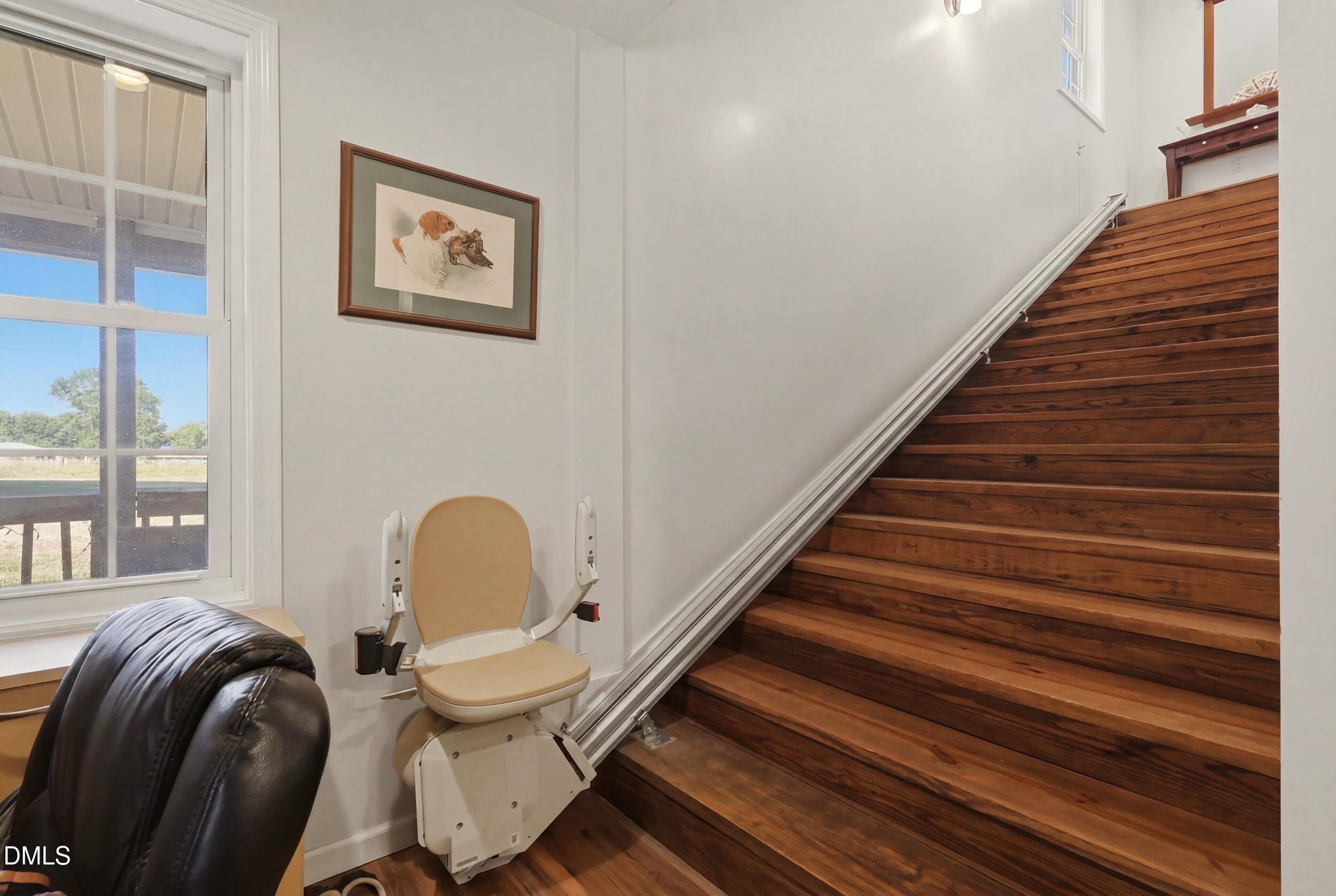 2631 South Jim Minor Road Haw River, NC 27258 - Photo 16 of 62 a room with stairs and furniture