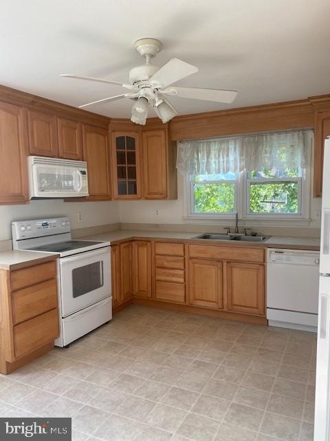 12209 Baines Corner Road Bealeton, VA 22712 - Photo 5 of 14 a kitchen with stainless steel appliances a stove sink and microwave