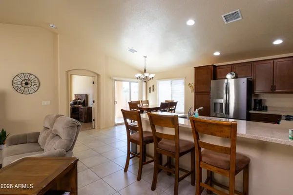 a kitchen with a dining table and chairs