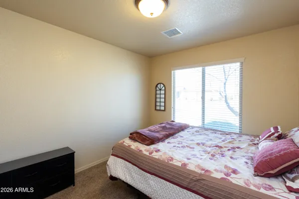 a view of an empty room with closet area