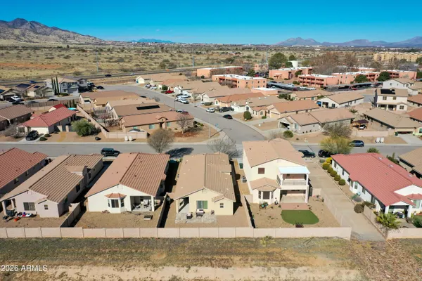 an aerial view of a house with balcony and garden space