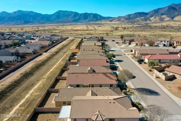an aerial view of residential houses with outdoor space