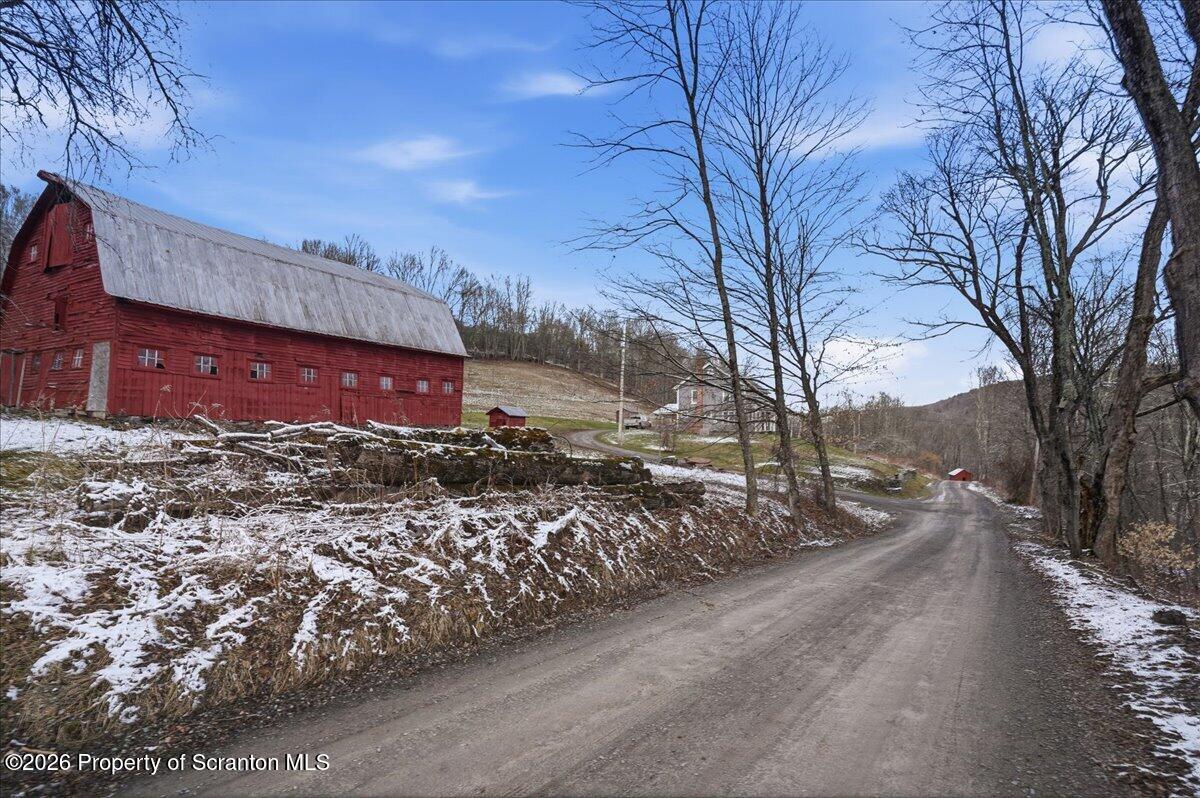 795 Wescott Road New Milford, PA 18834 - Photo 63 of 81 a view of a street with a building in the background