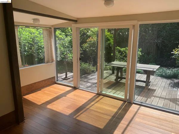 a view of a living room and floor to ceiling window