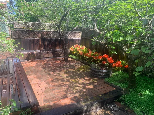 a view of a backyard with sitting area