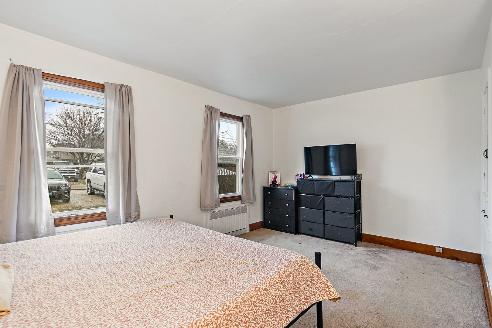 820 Lincoln Highway Rochelle, IL 61068 - Photo 19 of 27 a bedroom with a bed and a television