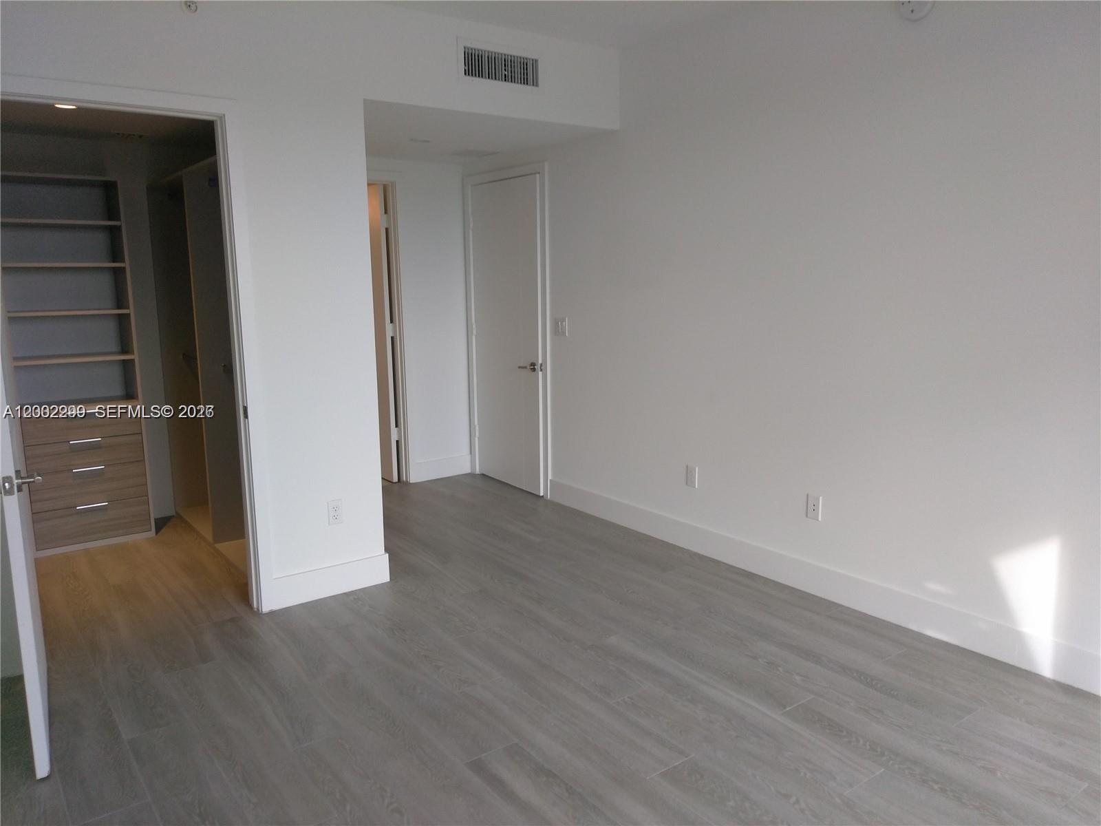 1010 Southwest 2nd Avenue, Unit 1901 Miami, FL 33130 - Photo 3 of 8 wooden floor in an empty room