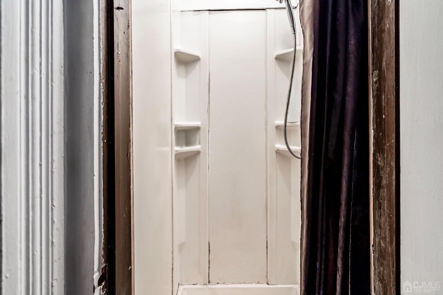 144 Main Street Butler, NJ 07405 - Photo 17 of 24 a view of a bathroom from a corridor