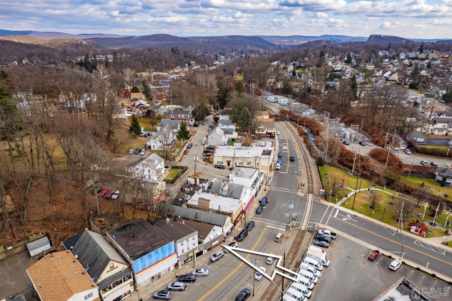 144 Main Street Butler, NJ 07405 - Photo 2 of 24 an aerial view of residential houses with outdoor space