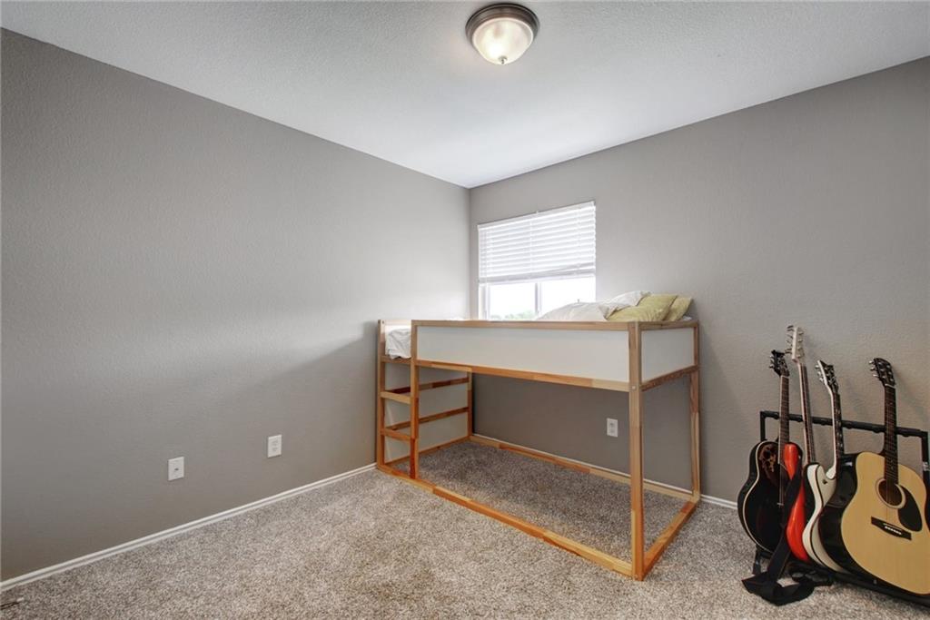 13905 Briarcreek Loop Manor, TX 78653 - Photo 16 of 25 Carpeted bedroom with baseboards