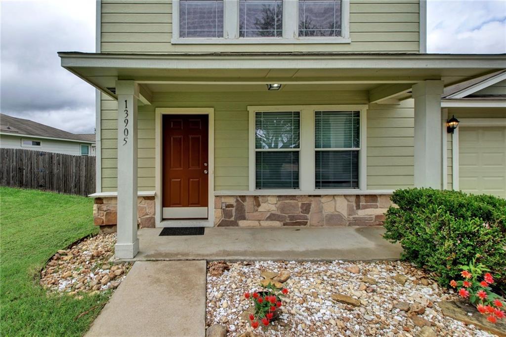 13905 Briarcreek Loop Manor, TX 78653 - Photo 2 of 25 View of exterior entry featuring a porch and stone siding