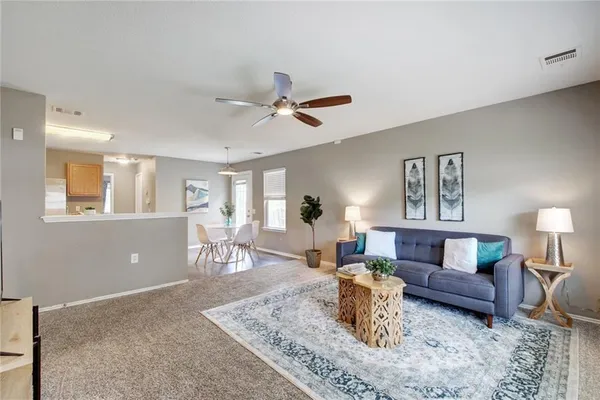 a living room with furniture and a table