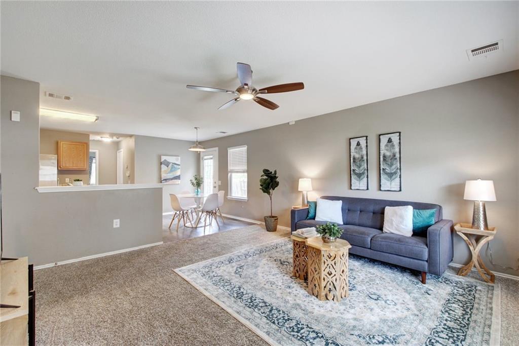 13905 Briarcreek Loop Manor, TX 78653 - Photo 3 of 25 Living room featuring a ceiling fan and light colored carpet