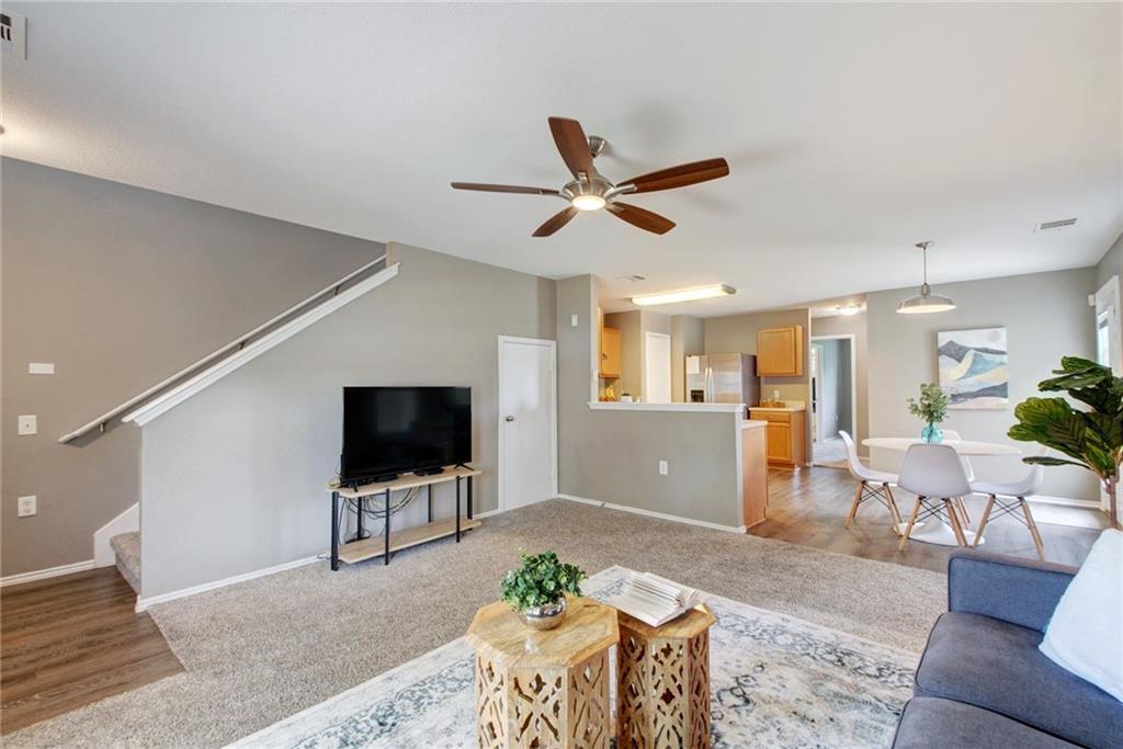 13905 Briarcreek Loop Manor, TX 78653 - Photo 4 of 25 Living area with a ceiling fan and light colored carpet