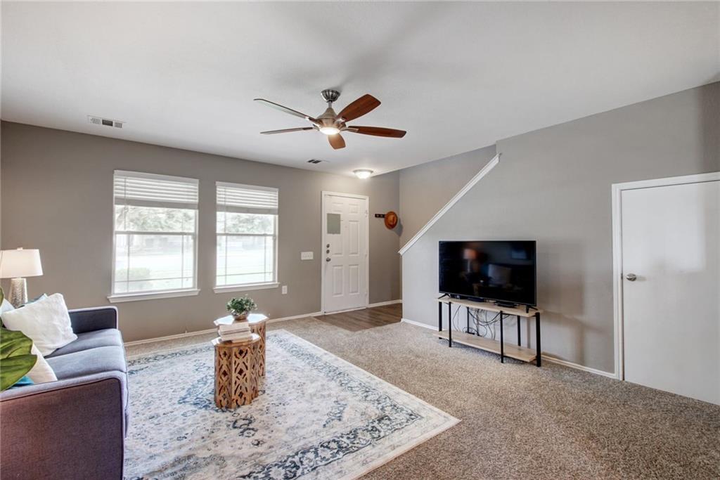 13905 Briarcreek Loop Manor, TX 78653 - Photo 5 of 25 Living area featuring ceiling fan and carpet flooring