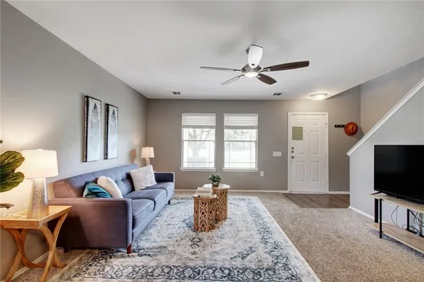 a living room with furniture and a flat screen tv