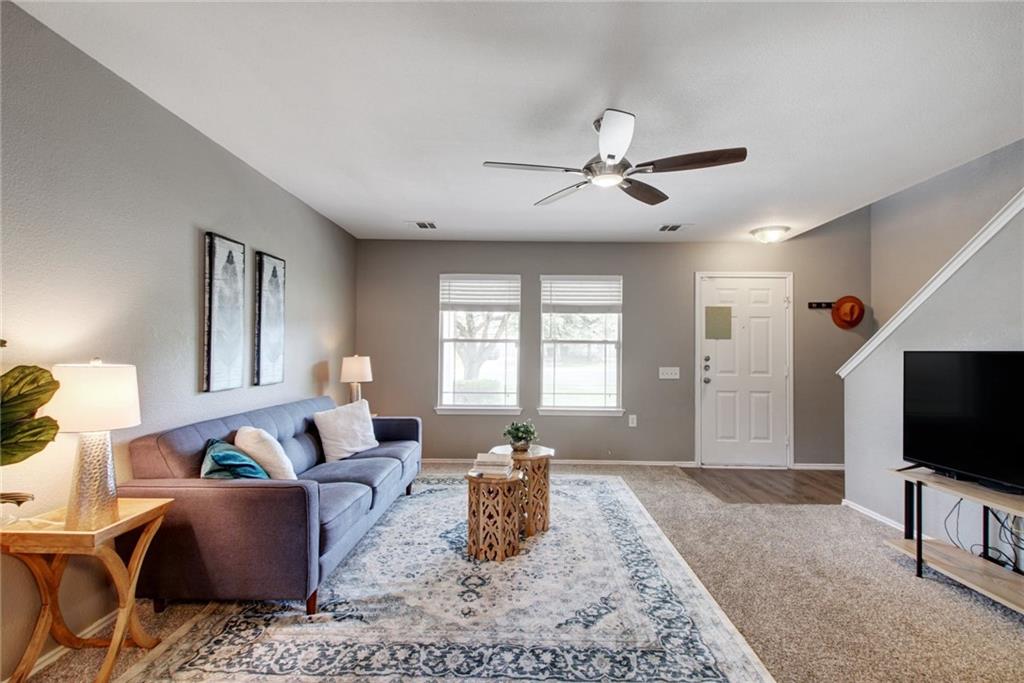 13905 Briarcreek Loop Manor, TX 78653 - Photo 6 of 25 Living area featuring ceiling fan and light colored carpet