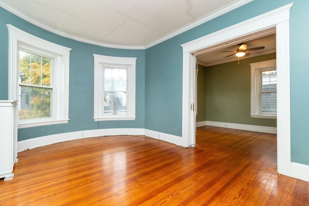 12 Pond Street, Unit 3 Boston, MA 02130 - Photo 13 of 39 a view of an empty room with wooden floor and a window