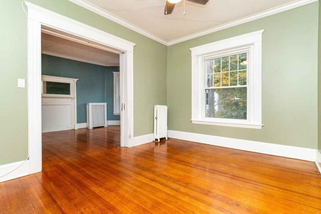 12 Pond Street, Unit 3 Boston, MA 02130 - Photo 14 of 39 a view of an empty room with wooden floor and a window