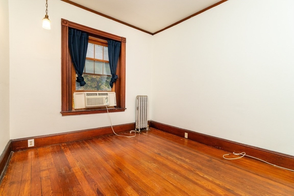 12 Pond Street, Unit 3 Boston, MA 02130 - Photo 24 of 39 a view of an empty room with wooden floor and a window