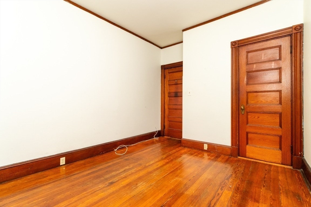 12 Pond Street, Unit 3 Boston, MA 02130 - Photo 25 of 39 an empty room with wooden floor