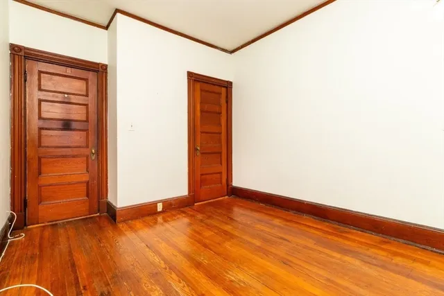 a view of an empty room with closet