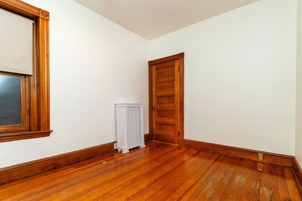 12 Pond Street, Unit 3 Boston, MA 02130 - Photo 29 of 39 a view of an empty room with wooden floor and a window