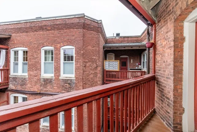 a view of a brick building from a balcony