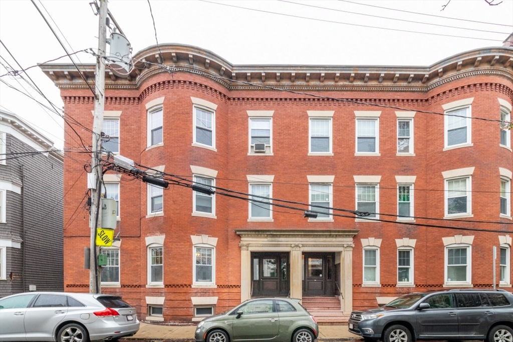 12 Pond Street, Unit 3 Boston, MA 02130 - Photo 37 of 39 a front view of a building with car parked