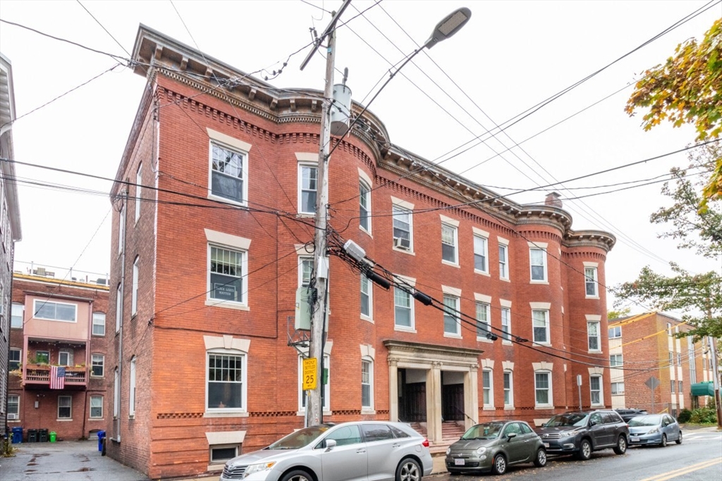 12 Pond Street, Unit 3 Boston, MA 02130 - Photo 38 of 39 a front view of a building with lot of cars parked