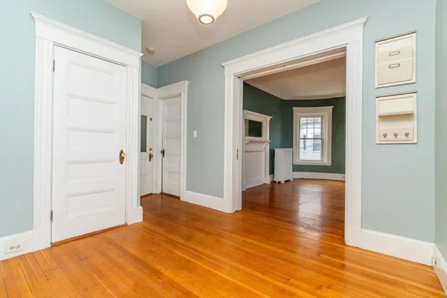 a view of livingroom with hardwood floor and hallway