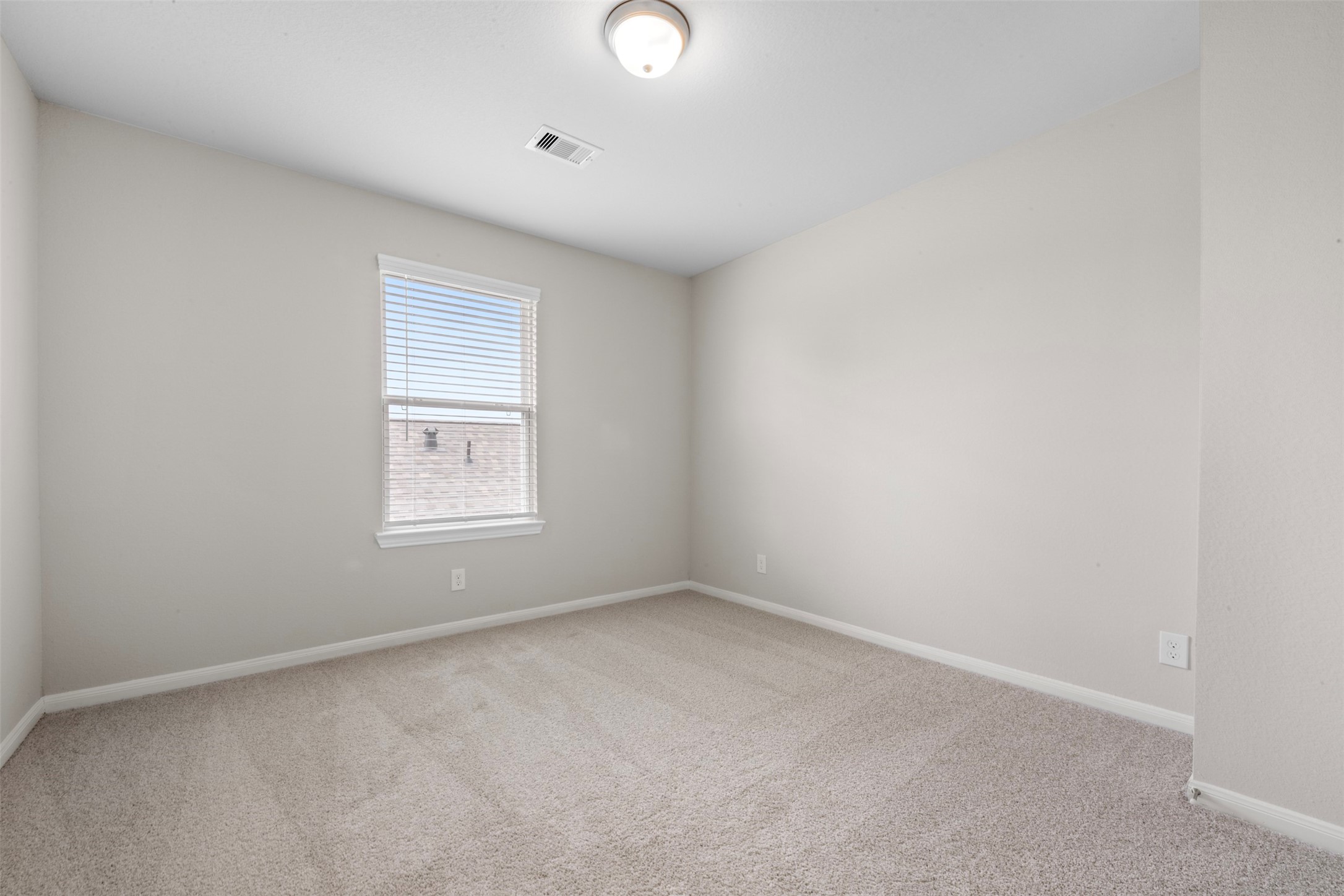 10783 Sora Drive Willis, TX 77378 - Photo 21 of 26 an empty room with windows