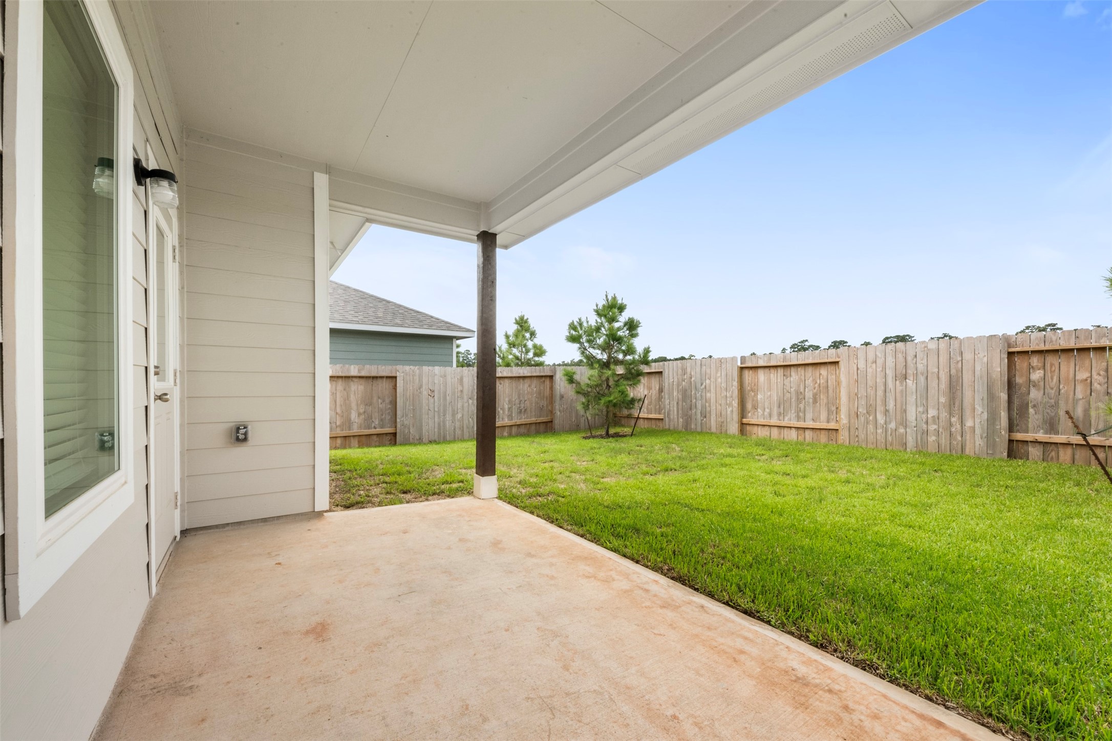 10783 Sora Drive Willis, TX 77378 - Photo 24 of 26 a view of a house with backyard and garden