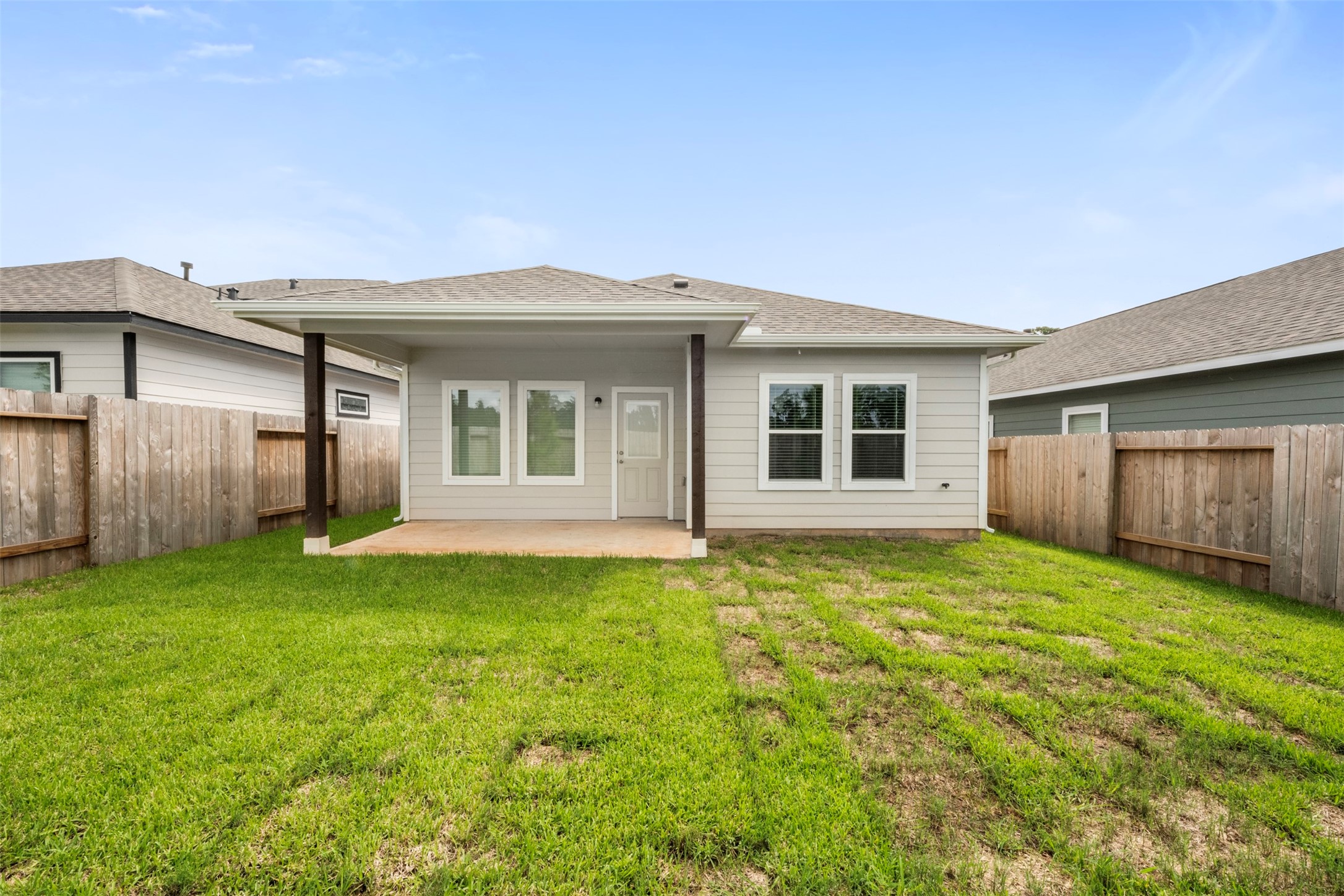 10783 Sora Drive Willis, TX 77378 - Photo 25 of 26 a view of a backyard with plants and large tree