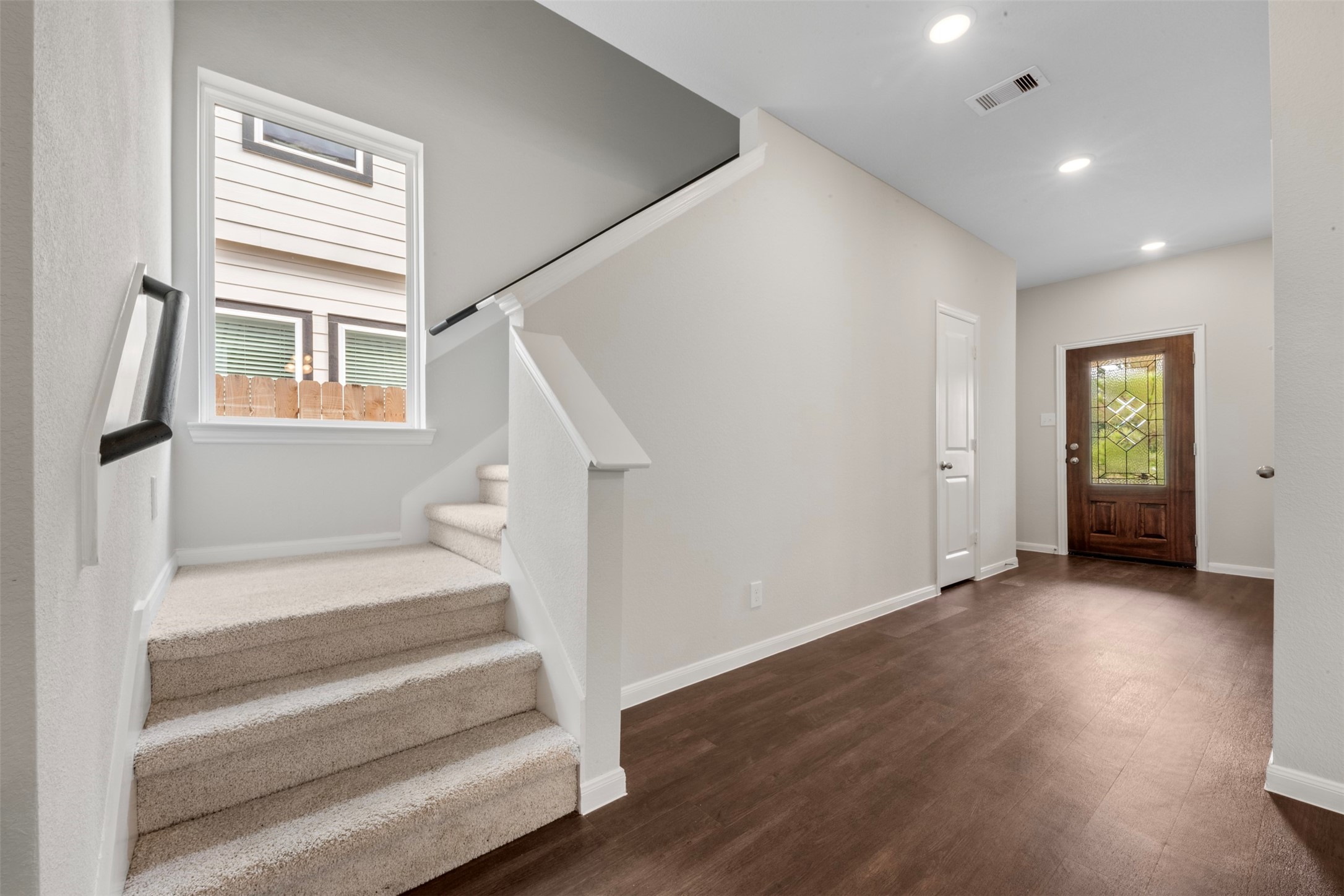 10783 Sora Drive Willis, TX 77378 - Photo 4 of 26 a view of entryway with wooden floor and stairs