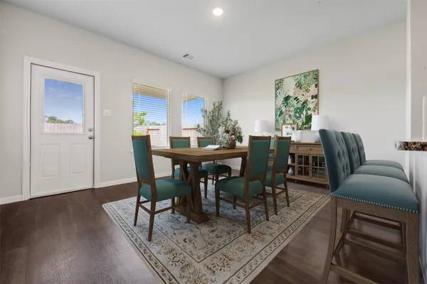 a view of a dining room with furniture