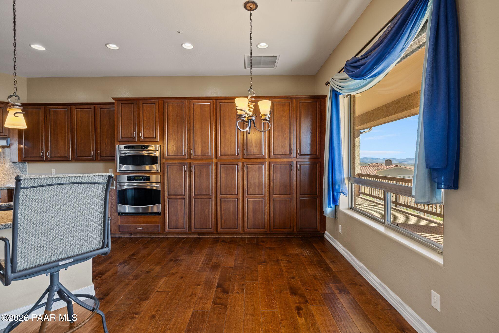 15411 East Rough Rider Ridge Mayer, AZ 86333 - Photo 16 of 57 a view of a kitchen with furniture and wooden floor