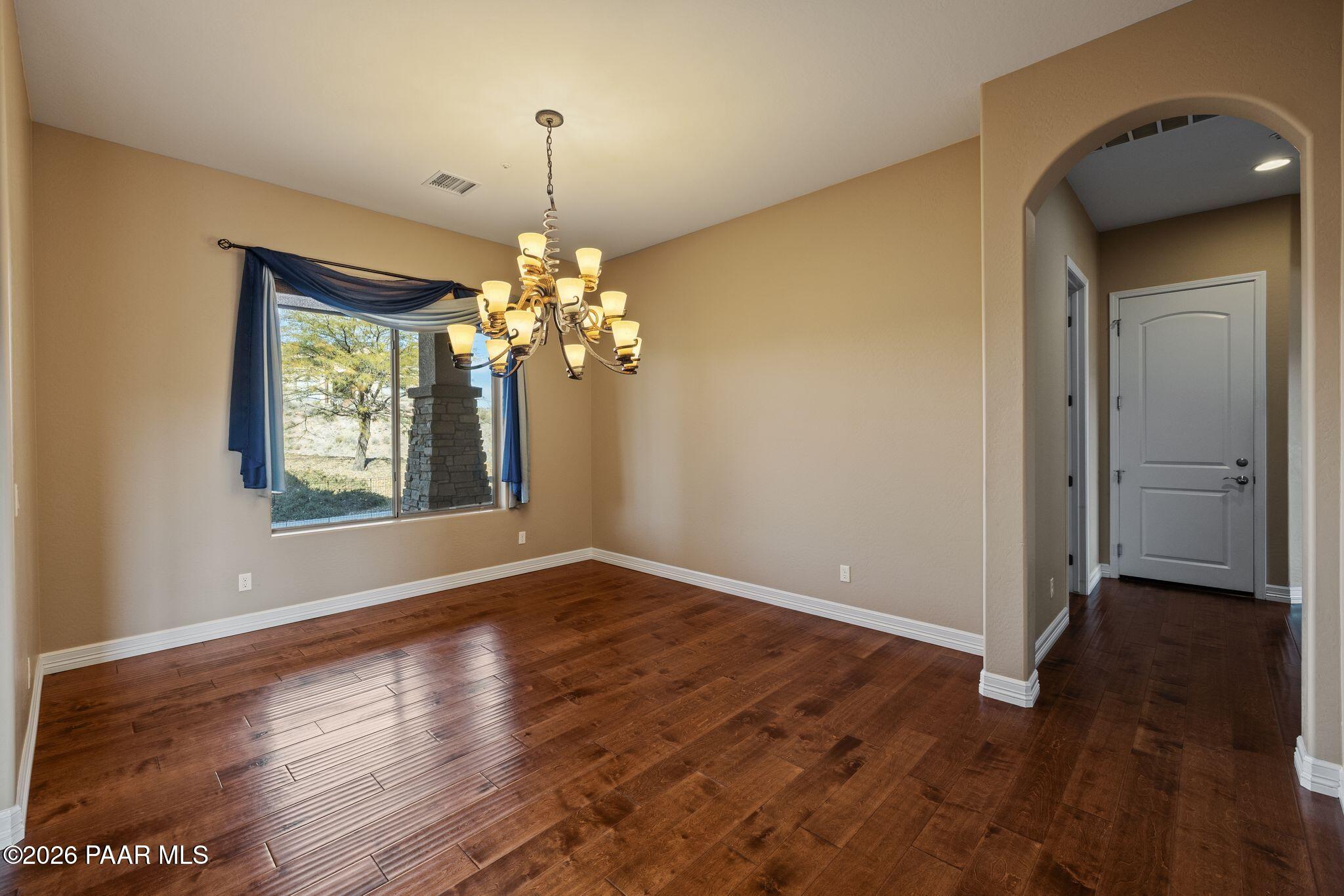 15411 East Rough Rider Ridge Mayer, AZ 86333 - Photo 19 of 57 a view of livingroom with chandelier and wooden floor