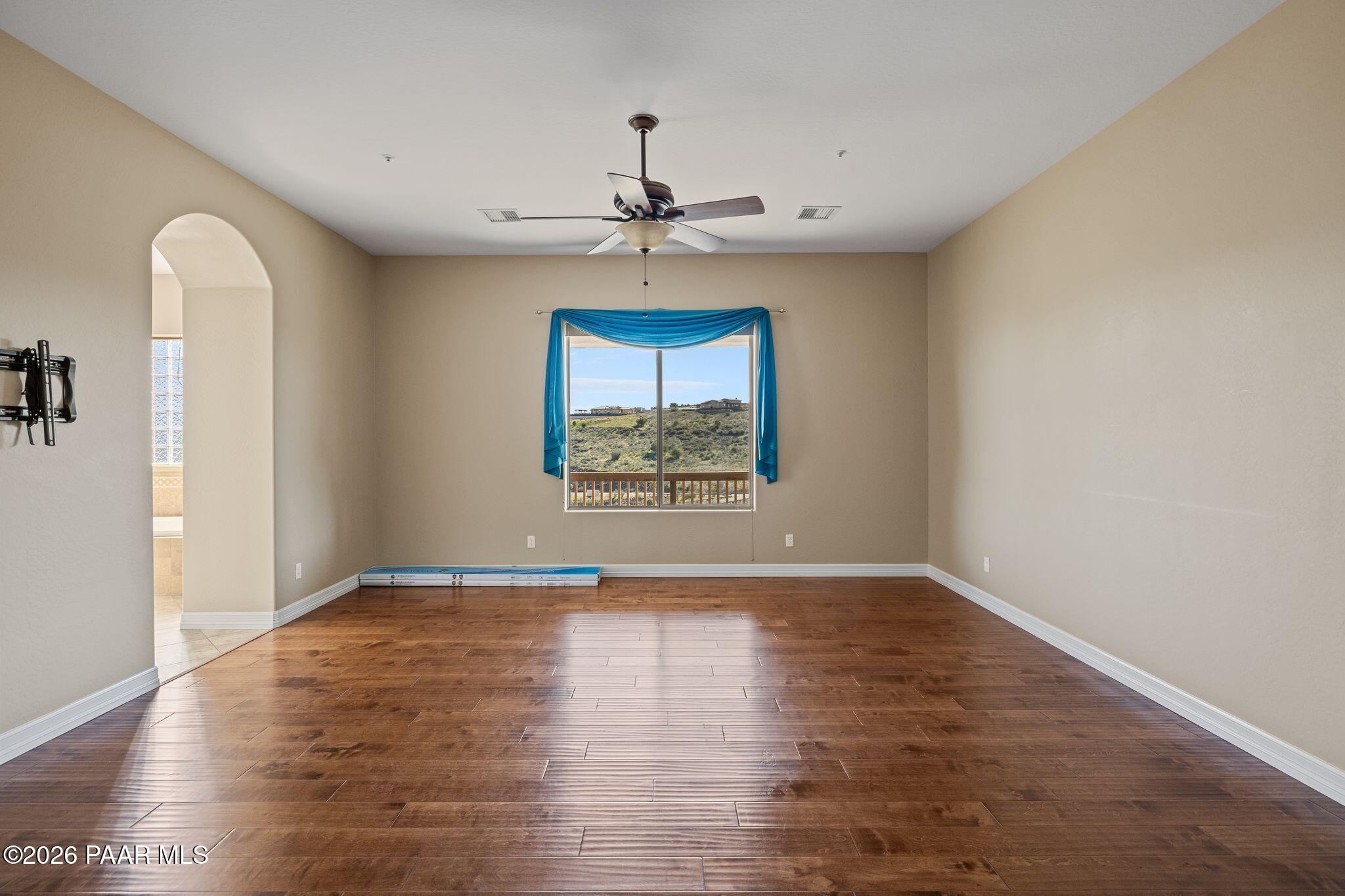 15411 East Rough Rider Ridge Mayer, AZ 86333 - Photo 22 of 57 wooden floor in an empty room with a window