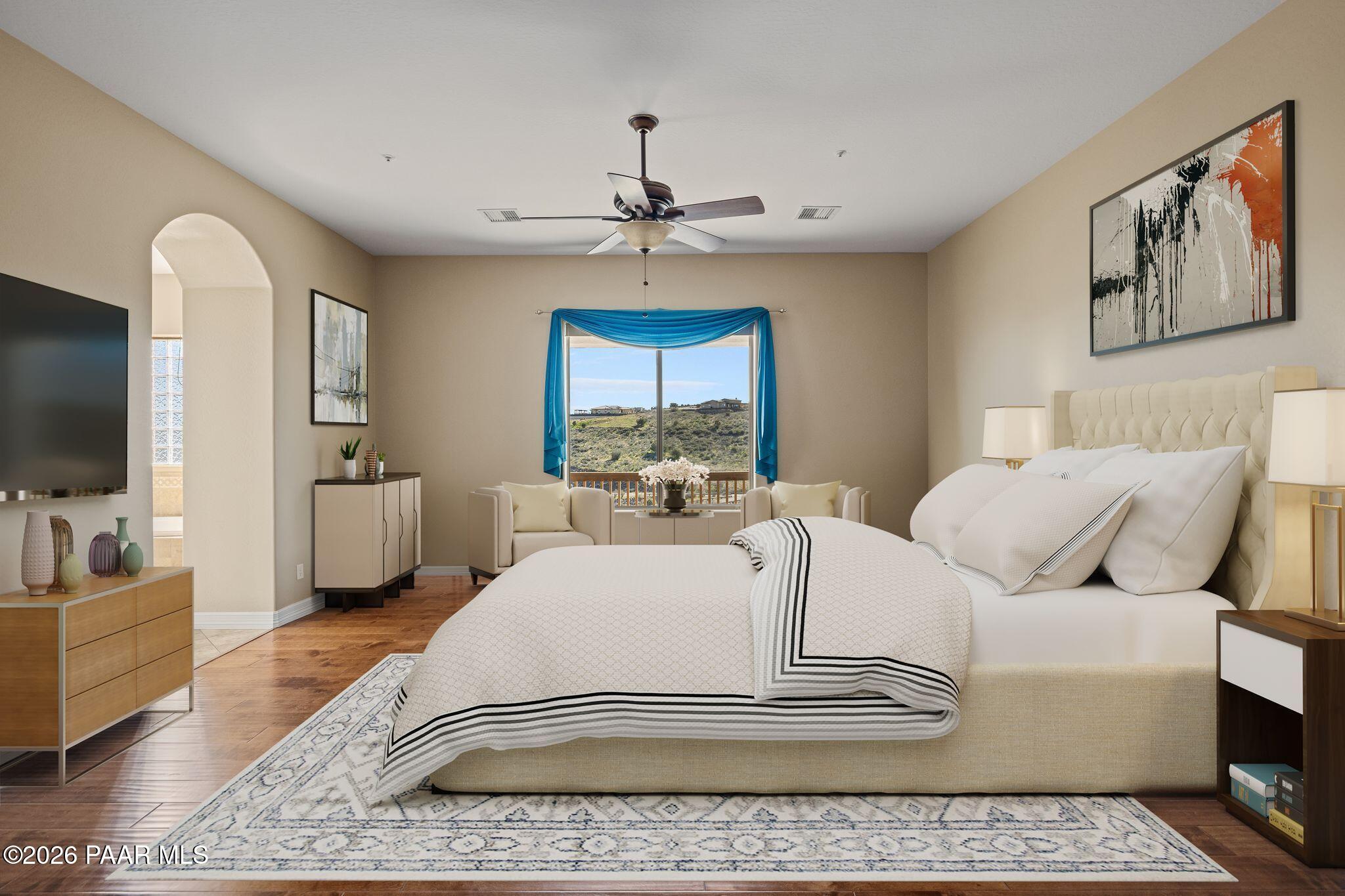 15411 East Rough Rider Ridge Mayer, AZ 86333 - Photo 23 of 57 a living room with furniture a flat screen tv and a rug