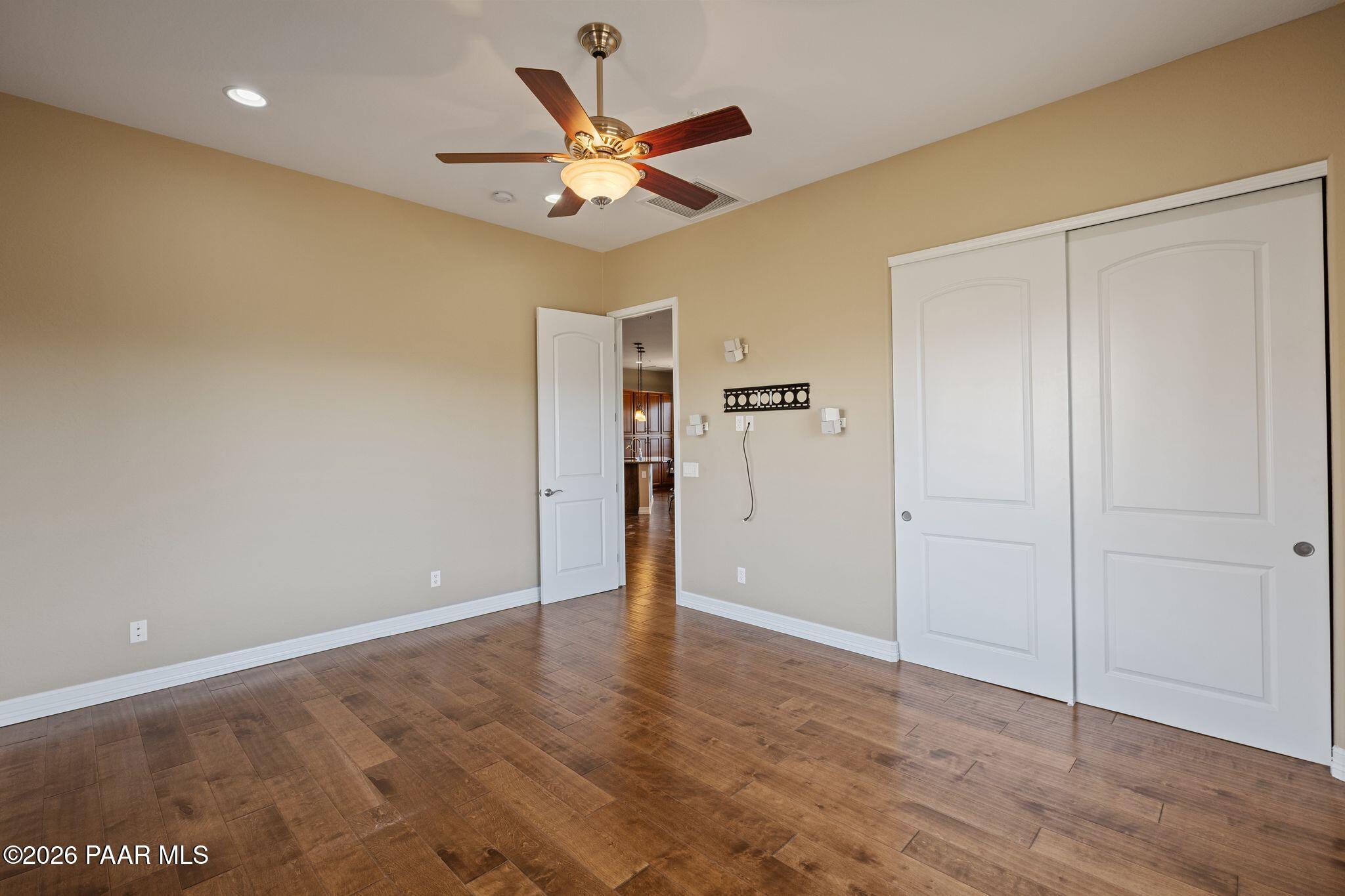 15411 East Rough Rider Ridge Mayer, AZ 86333 - Photo 32 of 57 wooden floor in an empty room with a window